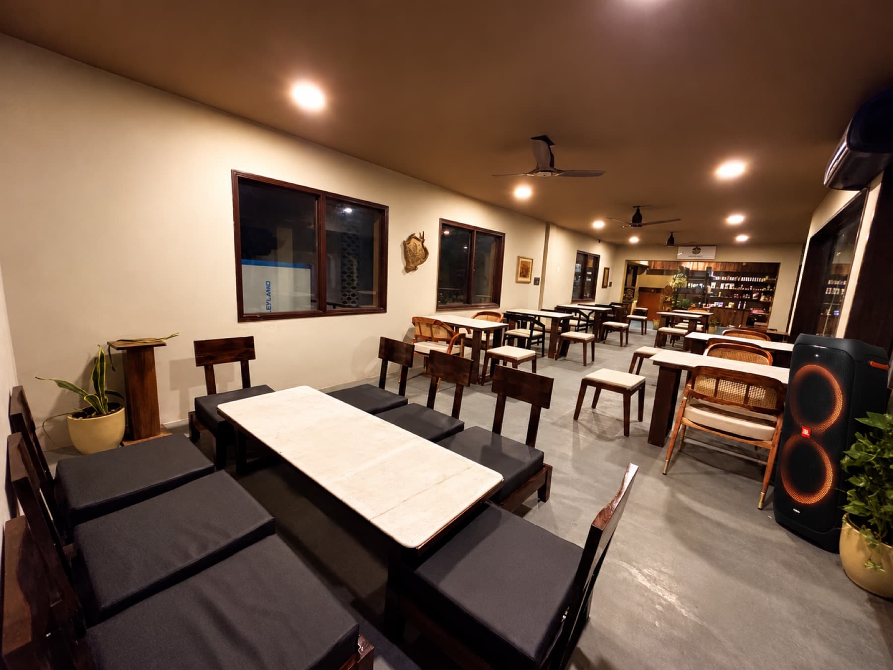 Event space floor with modular conference tables and audio speaker setup